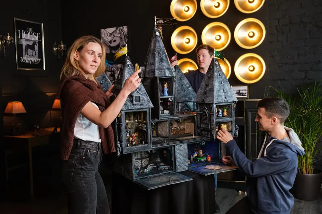 A family playing the Chronicles of the Living Castle attraction